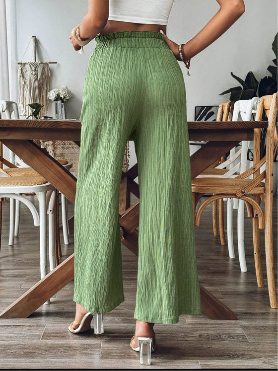 Back view of the Pocketed Wide Leg Pants, highlighting the elastic waistband and clean silhouette.