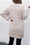 Back view of the Pocketed Open Front Long Sleeve Cardigan, featuring a multicolor knit pattern and functional pockets.