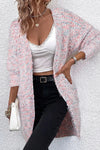 Model styled in the Pocketed Open Front Cardigan with casual black jeans and a white tank top, perfect for chilly days.