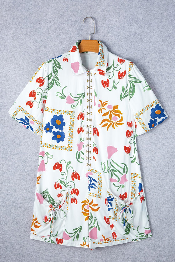 Front view of the Pocketed Printed Half Sleeve Romper showcasing the floral print and relaxed fit.