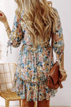 Front view of the Printed V-Neck Half Sleeve Dress showcasing its floral print and ruffled hem.