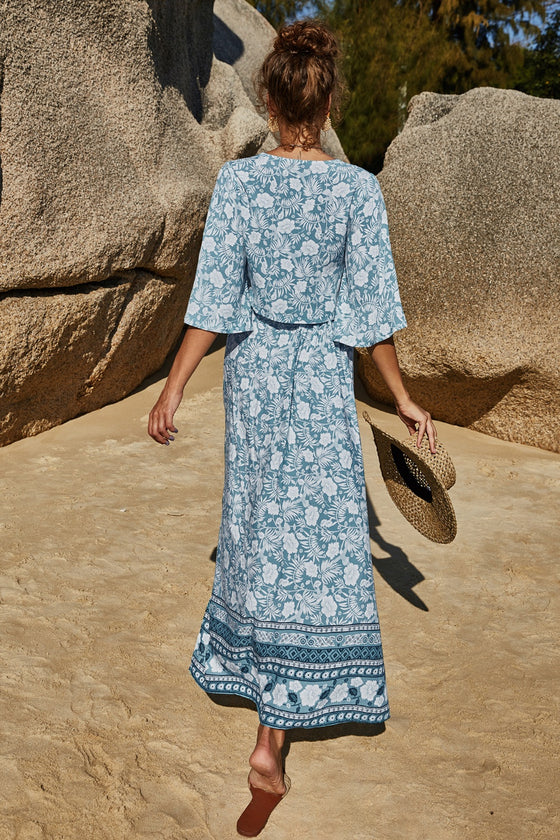 Back view of the floral two-piece set, showcasing the full skirt length and elegant fit.