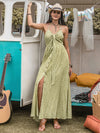 Model wearing the Printed Halter Neck Maxi Dress styled with boho accessories and sandals for a summer-ready look.