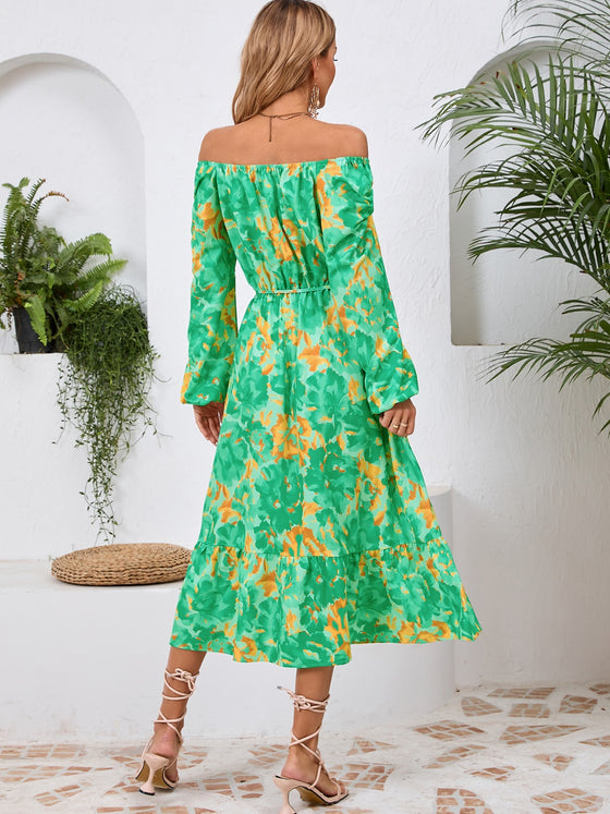 Back view of the Printed Long Sleeve Midi Dress showcasing its vibrant prints, tied waist, and off-shoulder neckline.