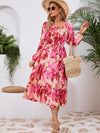 Front view of the Printed Long Sleeve Midi Dress showcasing its vibrant prints, tied waist, and off-shoulder neckline.