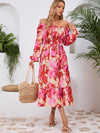 Front view of the Printed Long Sleeve Midi Dress showcasing its vibrant prints, tied waist, and off-shoulder neckline.