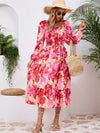 Side view of the Printed Long Sleeve Midi Dress highlighting the tiered hem and elegant long sleeves.