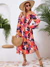 Side view of the Printed Long Sleeve Midi Dress highlighting the tiered hem and elegant long sleeves.