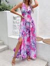 Front view of Printed Open Back Slit Sleeveless Dress with vibrant multicolored print and halter neckline.