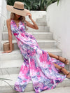  Model wearing the Printed Open Back Slit Sleeveless Dress, styled with accessories for a chic summer look.