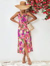 Model wearing the Printed Spaghetti Strap Front Slit Dress styled with a sun hat for a chic summer look.