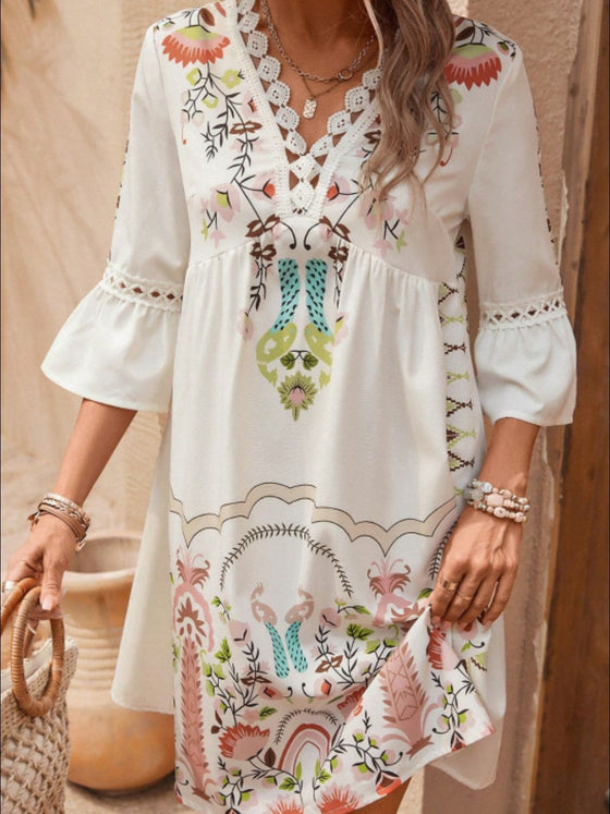 Tan dress shown front-facing with hands on hips, showcasing the structured yet breezy fit ideal for daytime wear.

