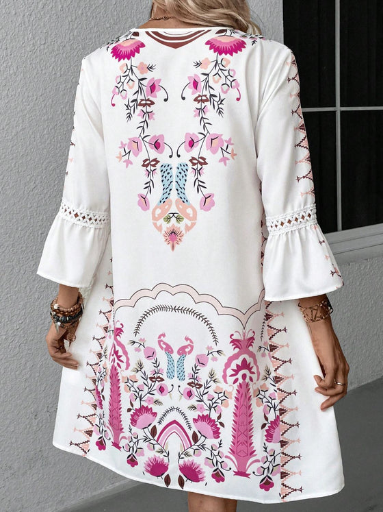 Back view of the white dress under natural lighting, showing the zipper closure and smooth fall of the dress down to the knees.

