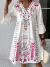 Model styled in the white printed version, facing forward with a serene expression, drawing attention to the delicate floral pattern.

