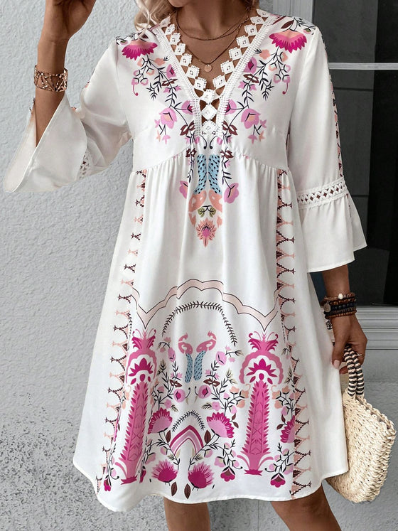 Model styled in the white printed version, facing forward with a serene expression, drawing attention to the delicate floral pattern.

