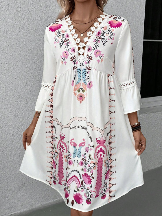 Front view focusing on the relaxed structure of the white printed fabric and the subtle shape created by the waist seam.

