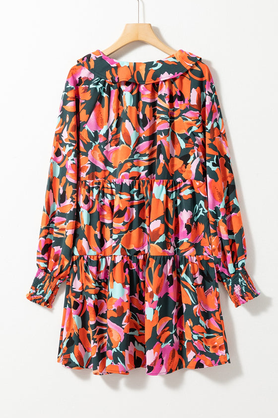 Close back view of the Printed Tie Neck Lantern Sleeve Mini Dress, emphasizing the flowy silhouette and vibrant print.