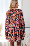 Back view of the Printed Tie Neck Lantern Sleeve Mini Dress, emphasizing the flowy silhouette and vibrant print.