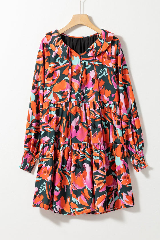 Front view of the Printed Tie Neck Lantern Sleeve Mini Dress, highlighting the bold print and tie neck detail.