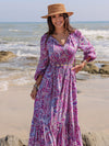 Front view of the Printed Tie Neck Balloon Sleeve Maxi Dress, featuring paisley print and a flowy silhouette