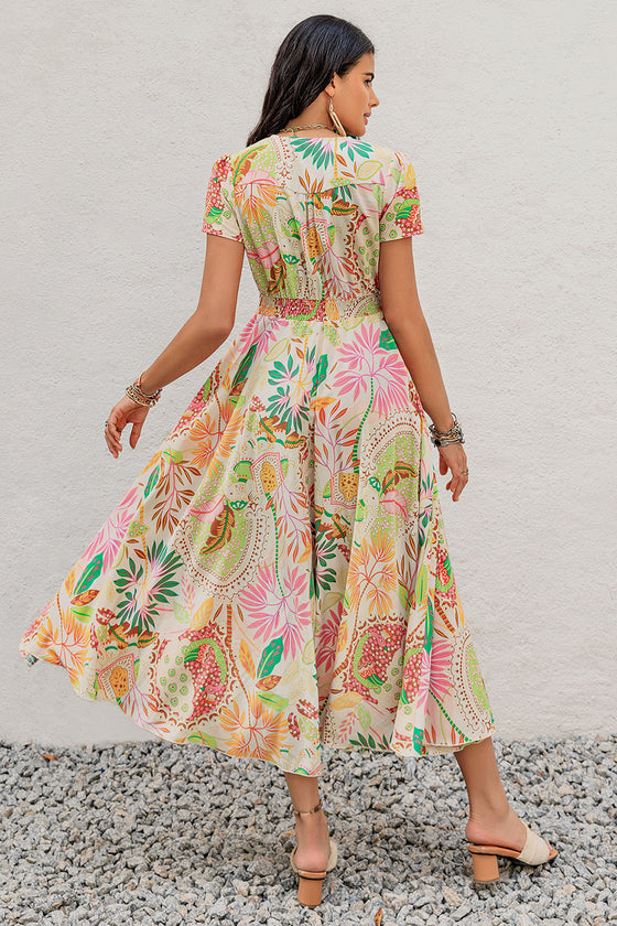 Back view of the Printed V-Neck Short Sleeve Midi Dress with a vibrant floral print and buttoned back.