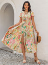 Front view of the Printed V-Neck Short Sleeve Midi Dress with a vibrant floral print and buttoned front.