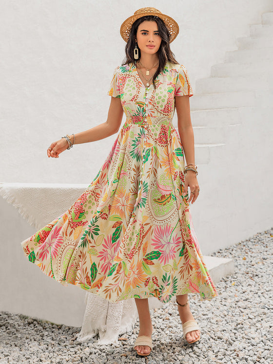 Model styling the Printed V-Neck Short Sleeve Midi Dress with accessories for a summer outing look.