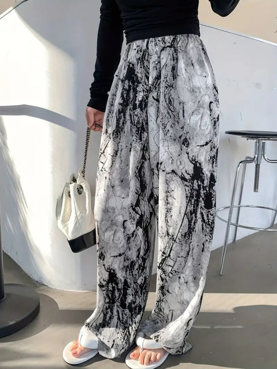 Model wearing Printed Wide Leg Pants styled with a black top, perfect for a chic everyday look