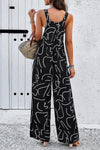 Back view of the Printed Wide Strap Jumpsuit, showing the secure fit of the wide straps.