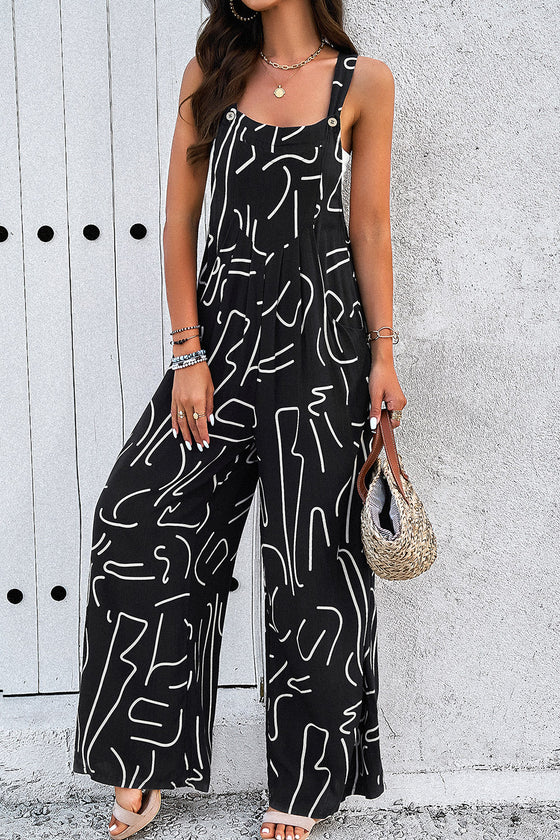 Side view of the Printed Wide Strap Jumpsuit, highlighting the wide-leg style and side pockets.