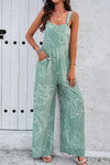 Front view of the Printed Wide Strap Jumpsuit with Pockets, showcasing an abstract white print on a navy background.