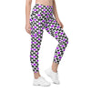 Front view of woman wearing white leggings with pop-art purple and black lips print. High waist compression leggings with side pockets for women.