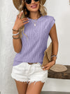 Model wears the vibrant purple top from the front, drawing attention to the embroidered detailing and classic neckline.


