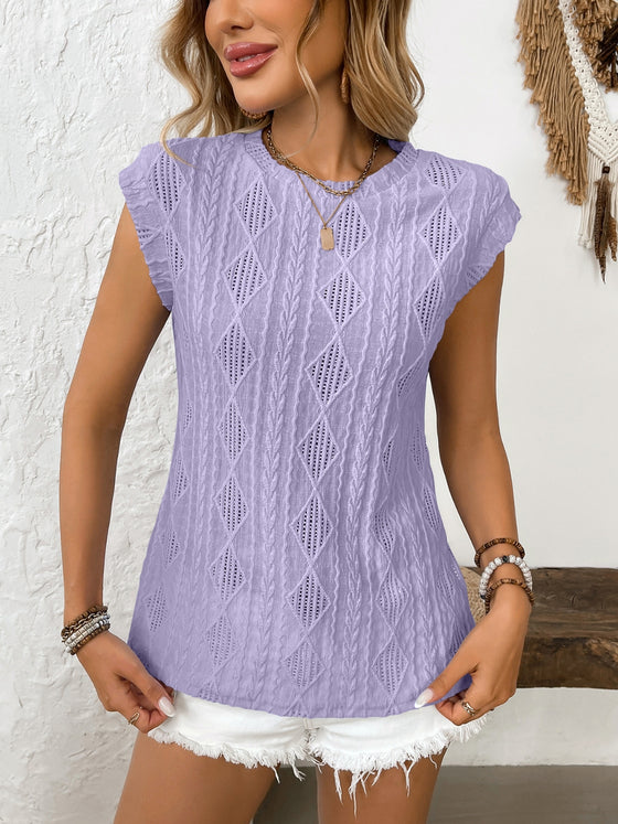 Model styled in high-waisted bottoms with the top tucked in, accentuating the fitted upper design.

