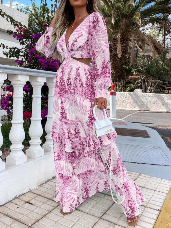 Full front view of the Purple Printed Maxi Dress with dramatic ruffles and a bold plunge neckline, enhanced with central cutouts and a flowing, romantic silhouette.