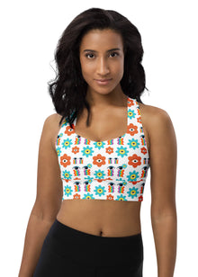  Woman wearing the Rainbow Eyes White High Support Sports Bra. Features a vibrant floral print, racerback design, and maximum support for gym workouts and high-impact activities.