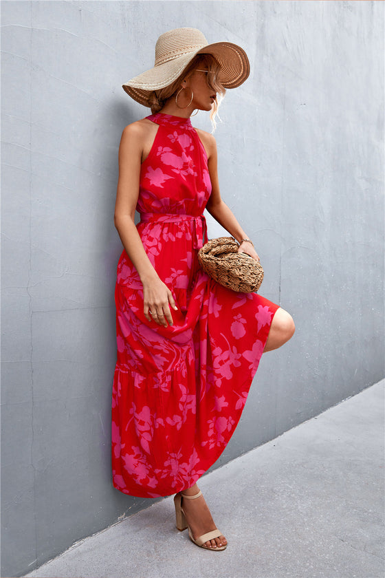 Side view of rose pink sleeveless tie waist maxi dress showing elegant silhouette and floral pattern—romantic and graceful warm-weather look.