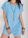 Front view of the Round Neck Short Sleeve Romper in light blue, showcasing the buttoned detail and relaxed fit.