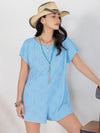 Model styled in the Round Neck Short Sleeve Romper paired with casual summer accessories, perfect for a relaxed outing.