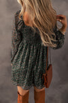 Back view of Ruched Printed Long Sleeve Mini Dress with flowy design and floral print