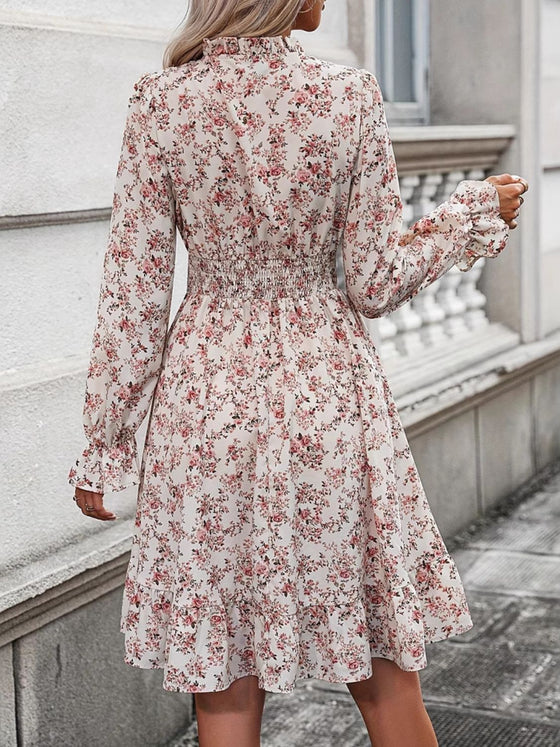 Back view of the Ruffle Hem Floral Surplice Long Sleeve Dress with ruffle details and a floral pattern.