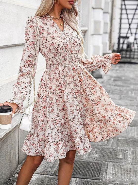 Side view of the Ruffle Hem Floral Surplice Long Sleeve Dress showcasing its flattering cinched waist and elegant fit.