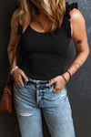 Model styled in the black Ruffled Round Neck Tank paired with a crossbody bag and layered jewelry for a casual chic look.