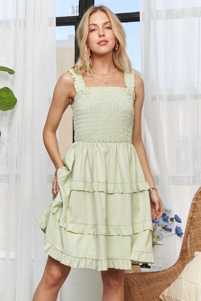 A classic front shot showcasing the timeless sage-striped design with a modern smocked fit for effortless styling.