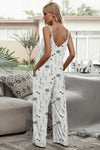 Back view of the Shiny Printed Spaghetti Strap Jumpsuit with adjustable straps and flowy design.