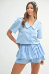  Full front view of the sky blue crop top and shorts outfit, showcasing its fresh, casual design perfect for summer days.