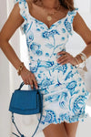Front close-up of sky blue floral mini dress featuring sweetheart neckline and breezy lightweight fabric—perfect for beach days and sunny strolls.