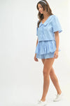 Side view of the crop set showing the loose fit and flattering length of the shorts paired with a relaxed top.