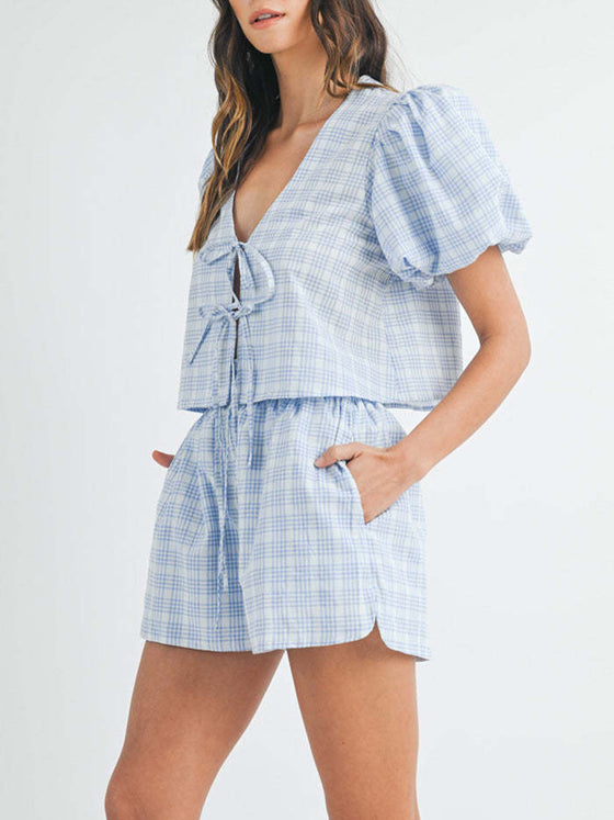 Another front view of the sky blue set, highlighting the flattering V-neck top with puff sleeves and the high-waisted shorts, perfect for casual outings with a touch of feminine flair.

