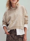 Front view of the Slit Round Neck Long Sleeve Sweater in beige, featuring a relaxed fit and modern slit details.